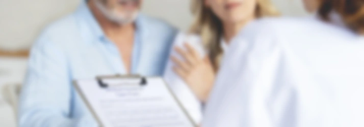 Blurred image of a patient consultation scene