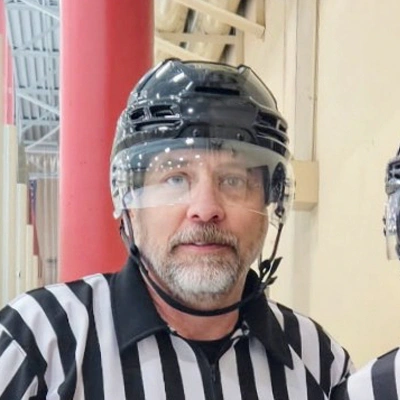 Dr. Kyle dressed as an ice hockey referee